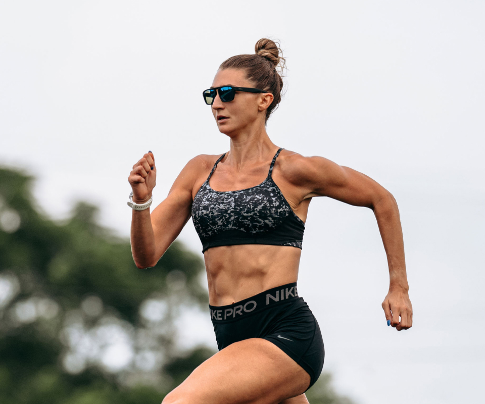 Woman sprinting wearing Estacado sunglasses