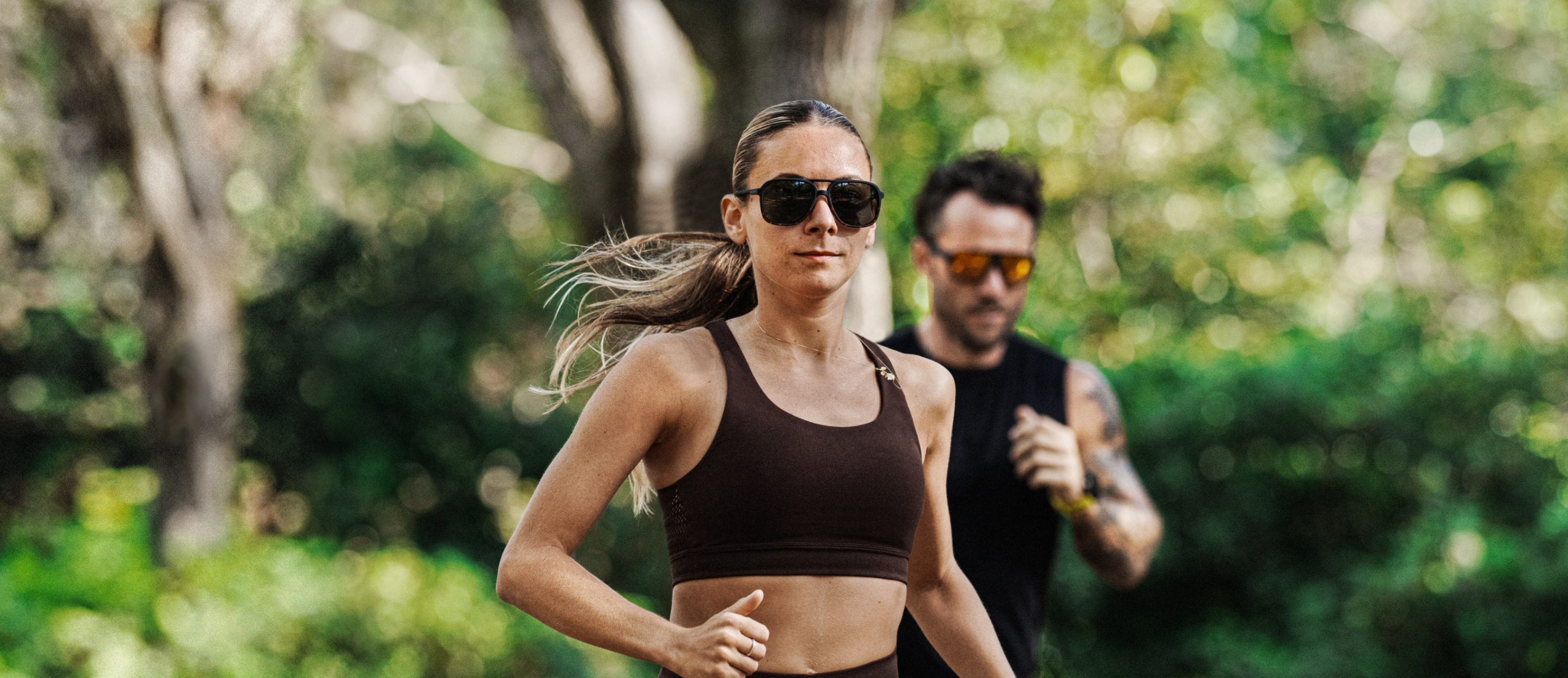 Man and woman jogging in the woods