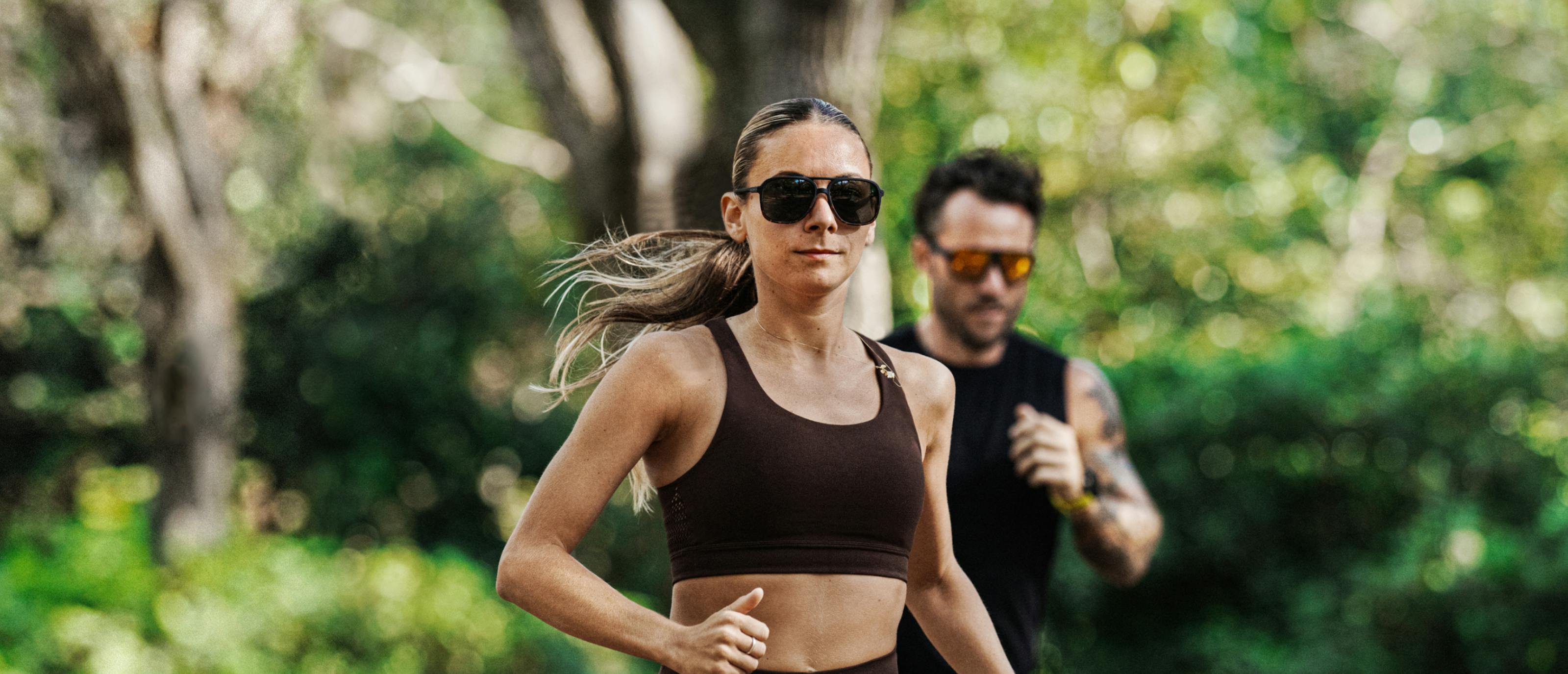 Man and woman jogging in the woods
