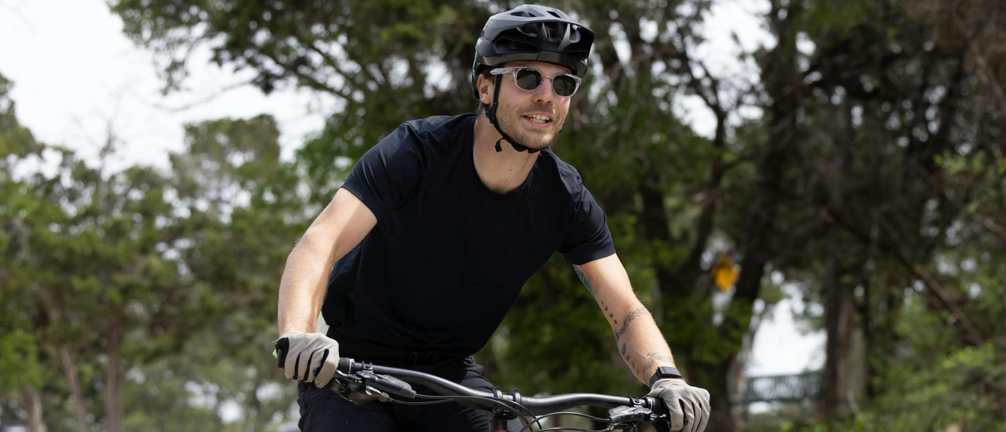 Man riding bike wearing Hamilton sunglasses