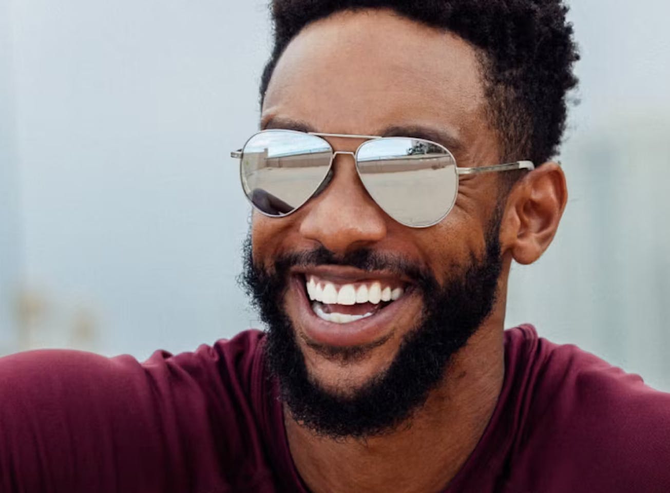 Man wearing Phantom mirrored sunglasses smiling