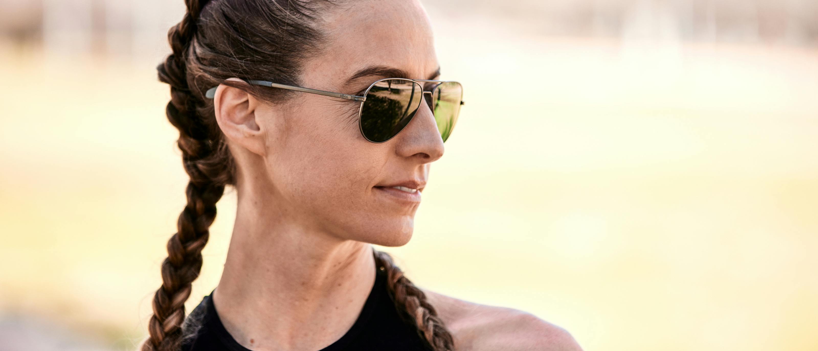 Woman wearing black shirt and Phantom mirrored sunglasses