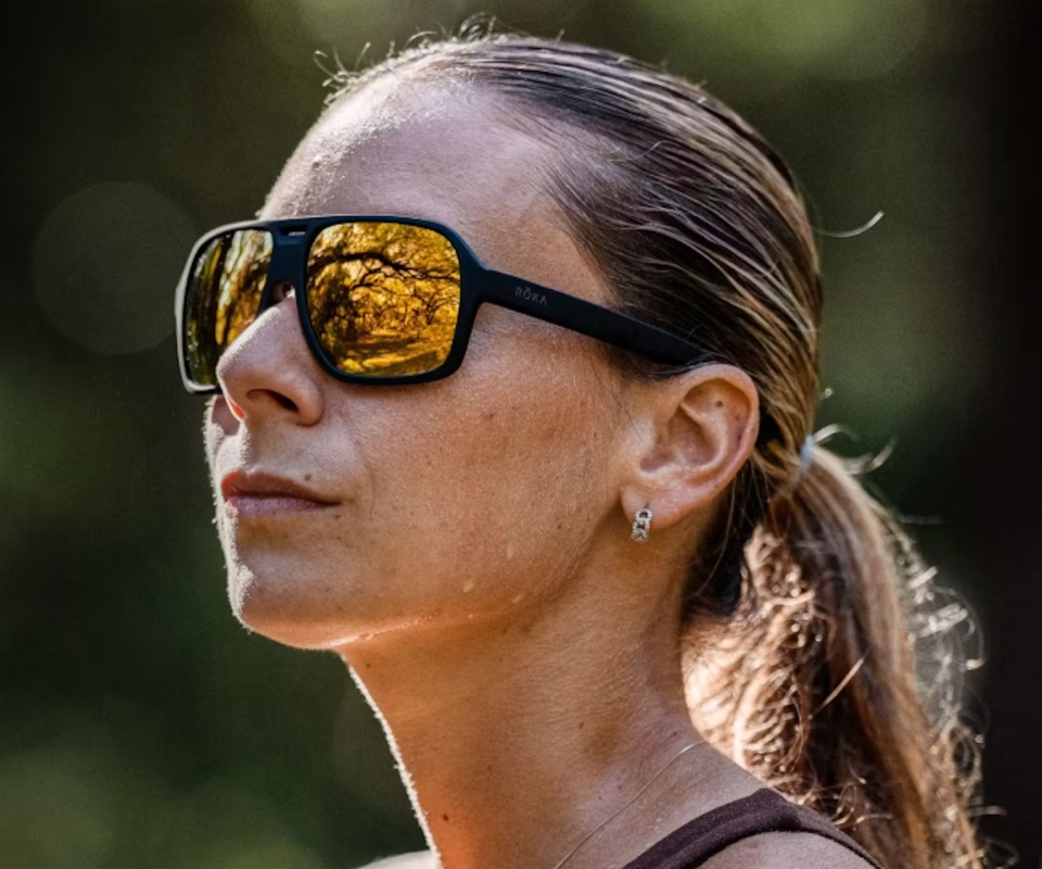 Woman wearing gold mirror Torino sunglasses