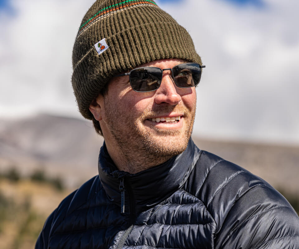 Man wearing beanie and Vapor sunglasses