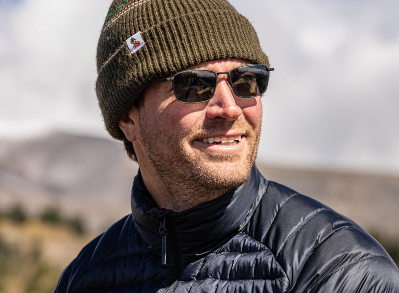 Man wearing beanie and Vapor sunglasses