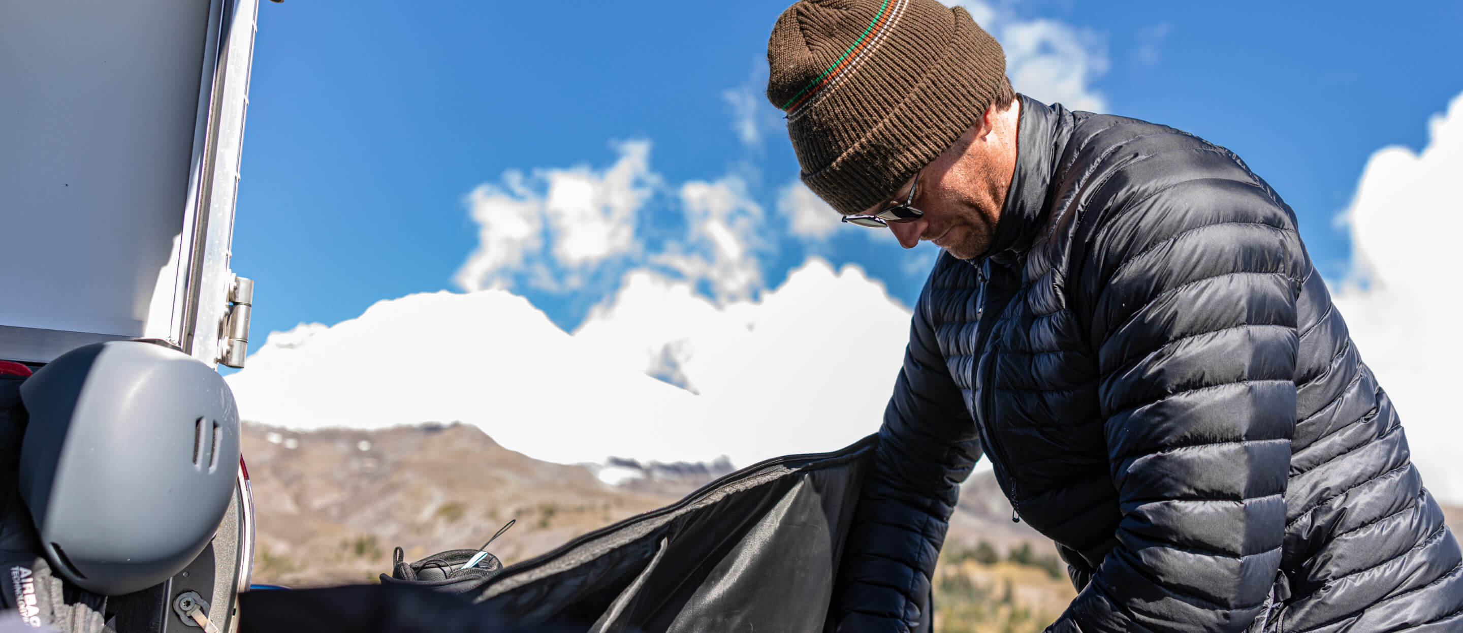Man wearing beanie and Vapor sunglasses