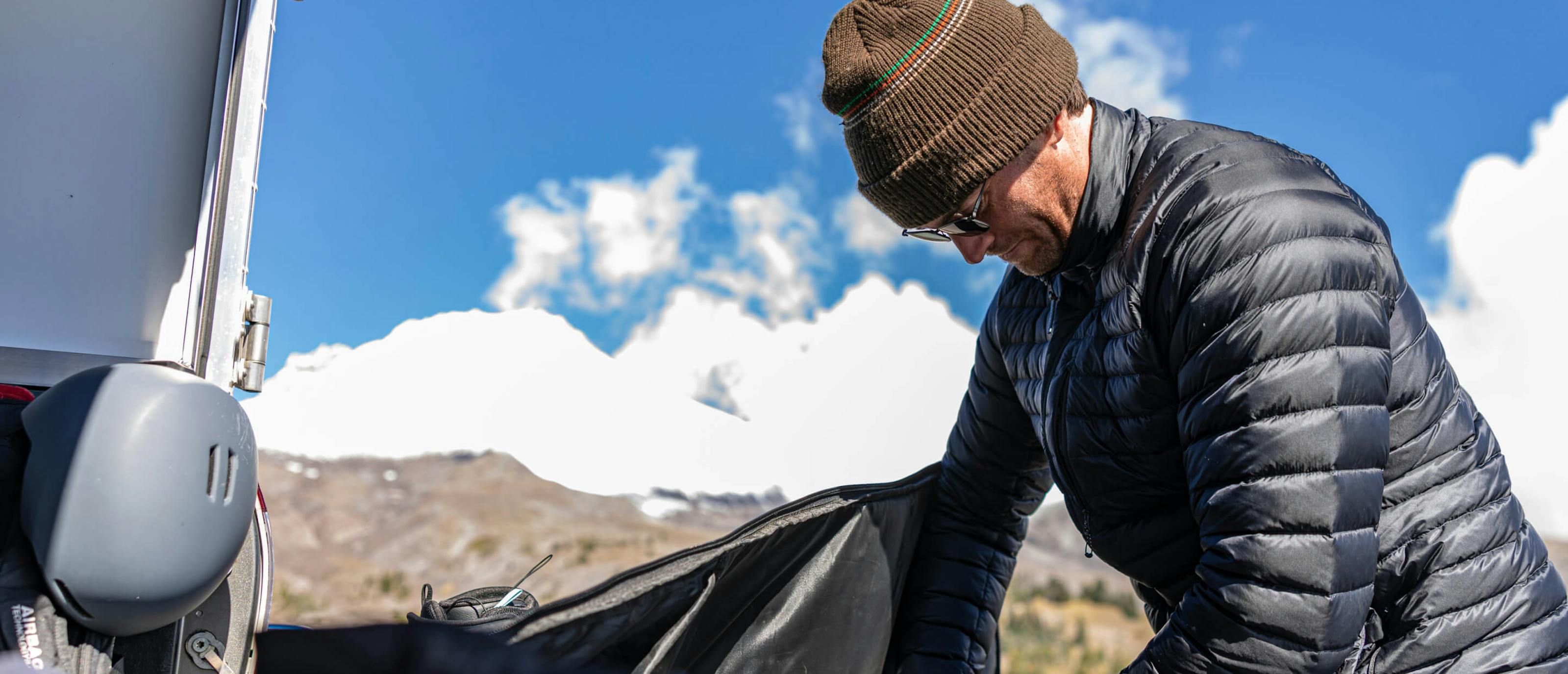 Man wearing beanie and Vapor sunglasses