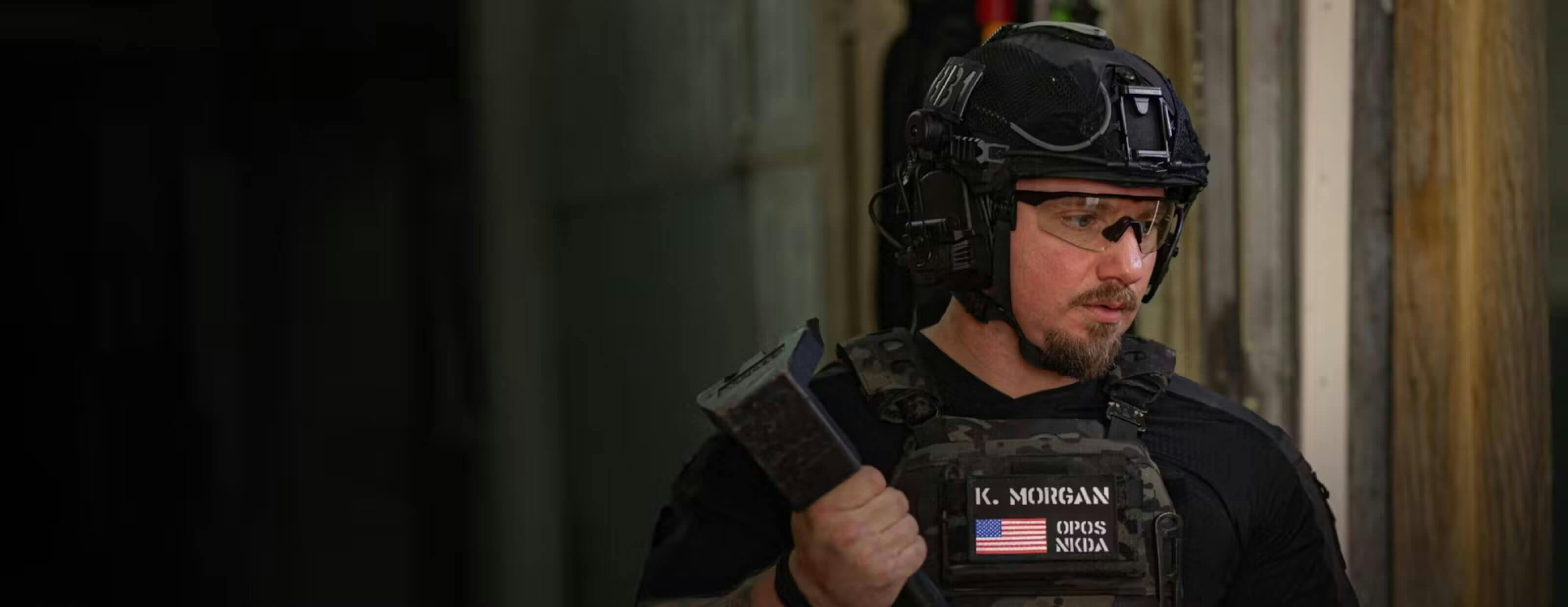 Man wearing tactical gear and ROKA glasses