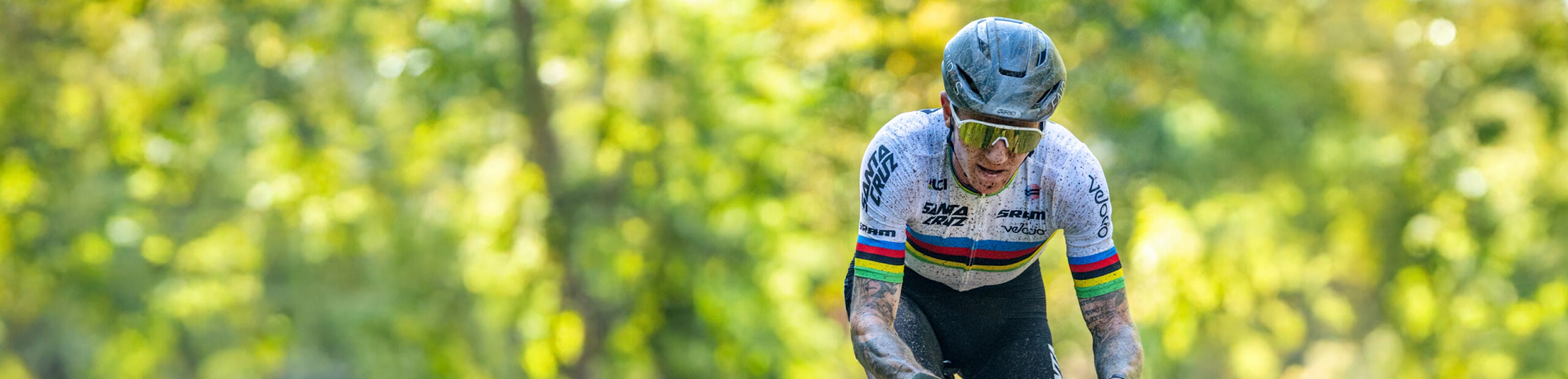 Man cycling in the woods wearing San Remo Sunglasses
