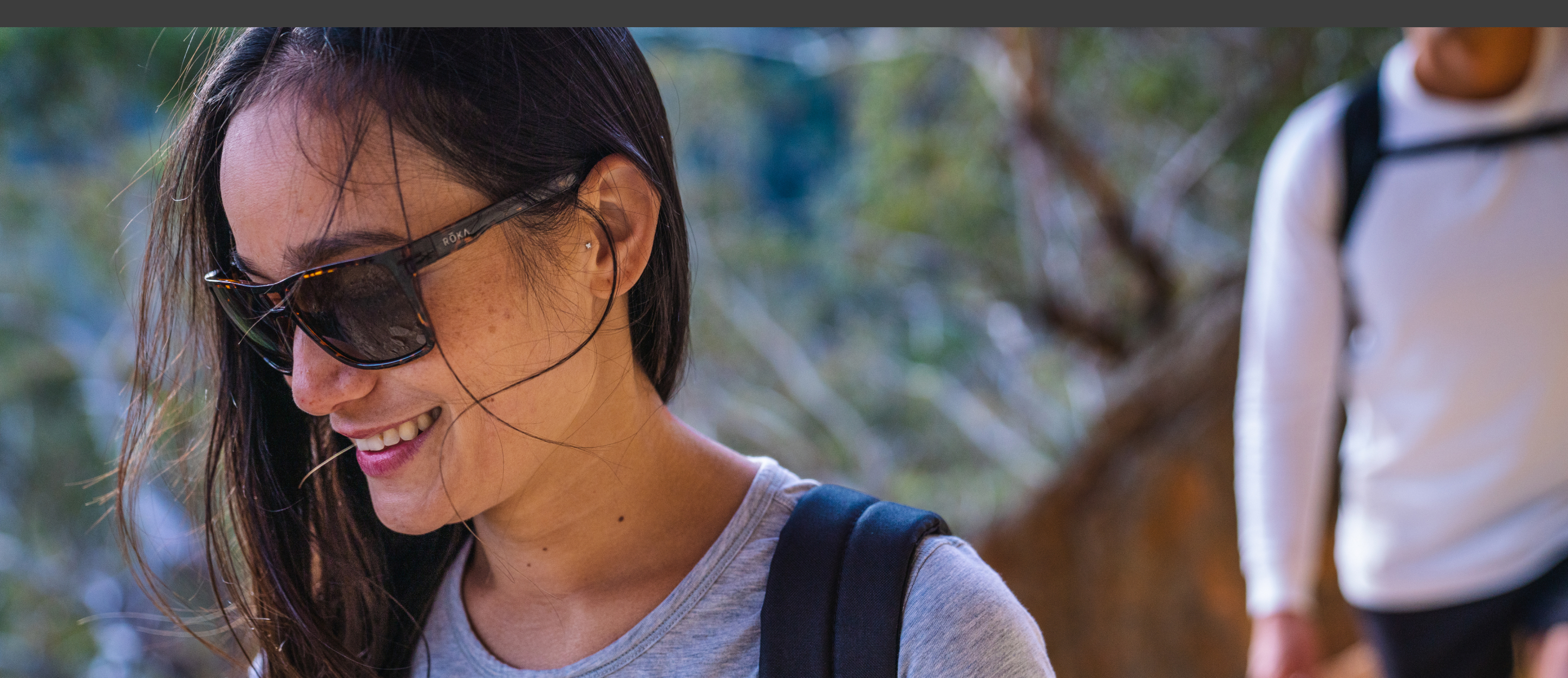 Woman hiking in Kona sunglasses