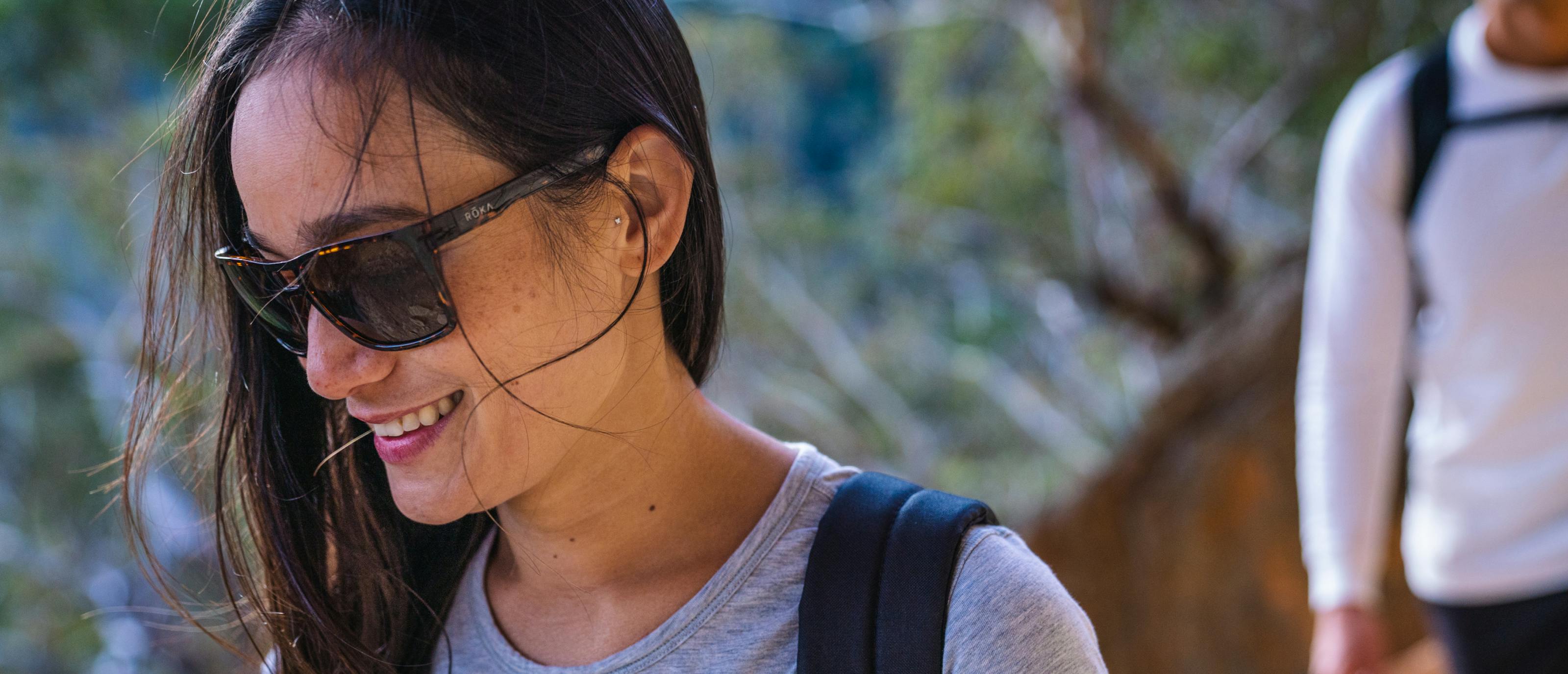 Woman hiking in Kona sunglasses