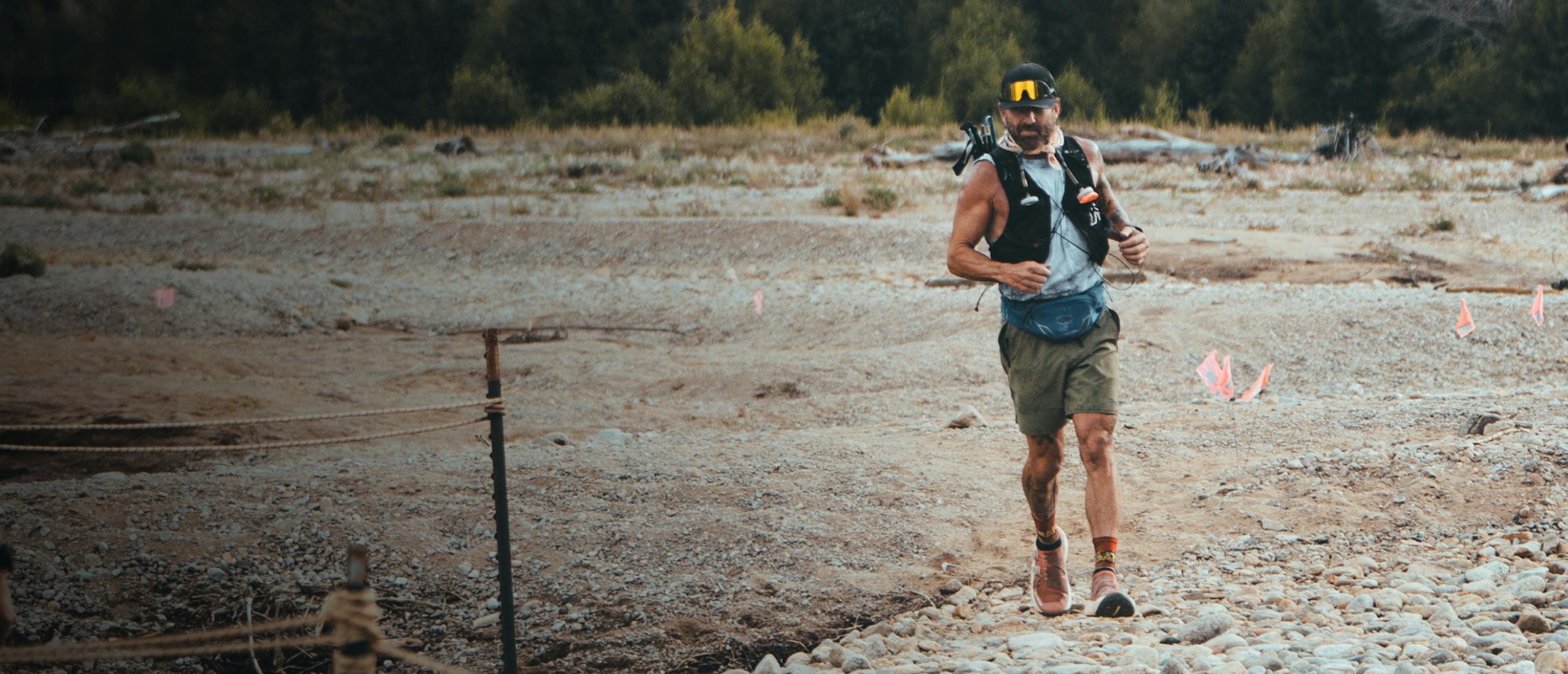 Cam Hanes running on rocks