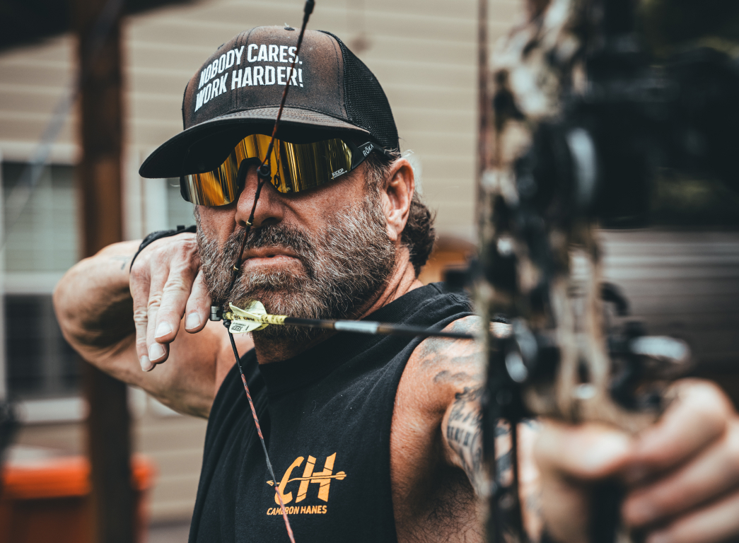 Man shooting bow and arow