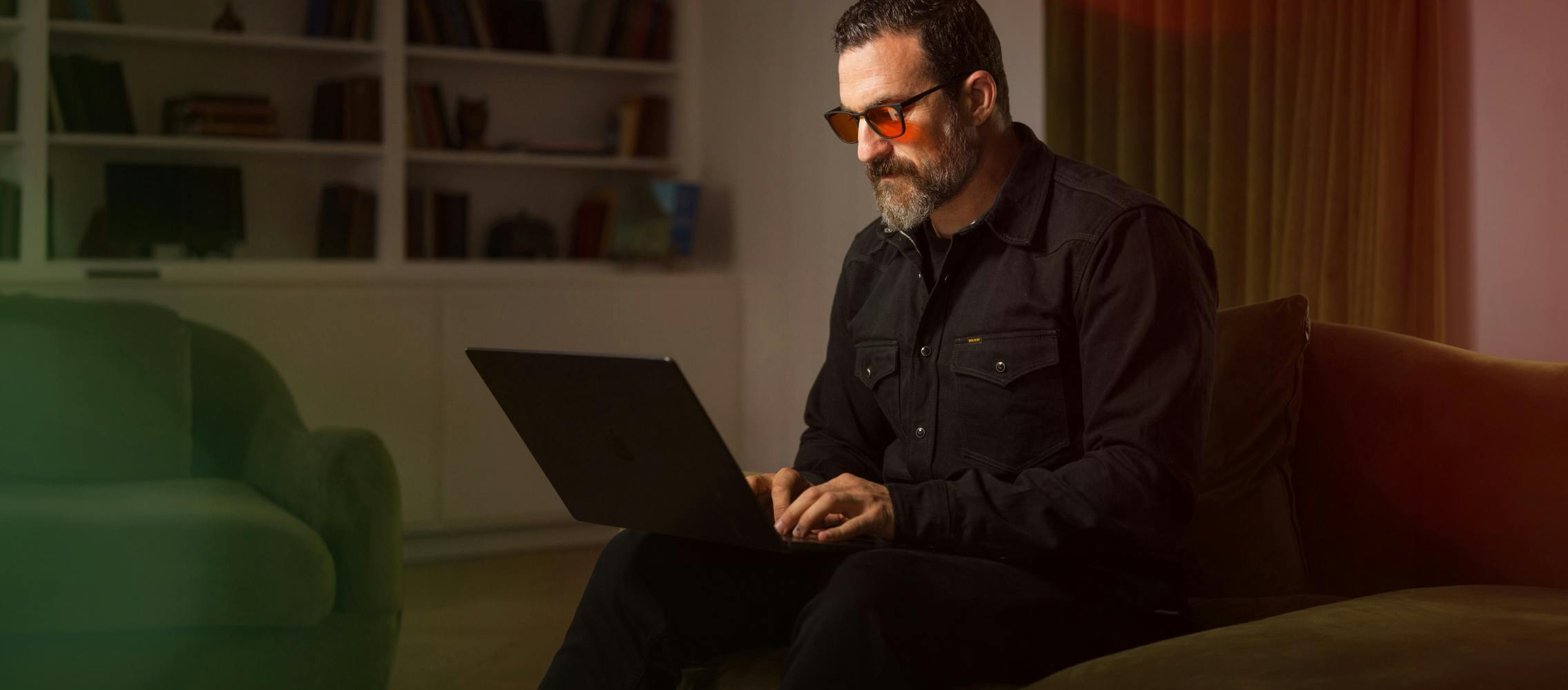 Huberman wearing red lens glasses