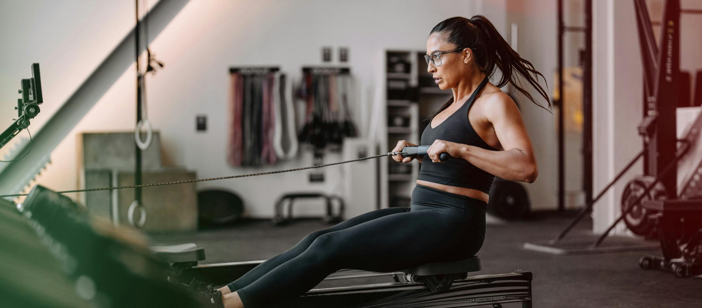 Woman using rowing machine