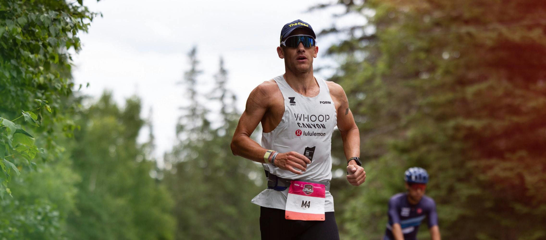 Man running triathlon in the woods