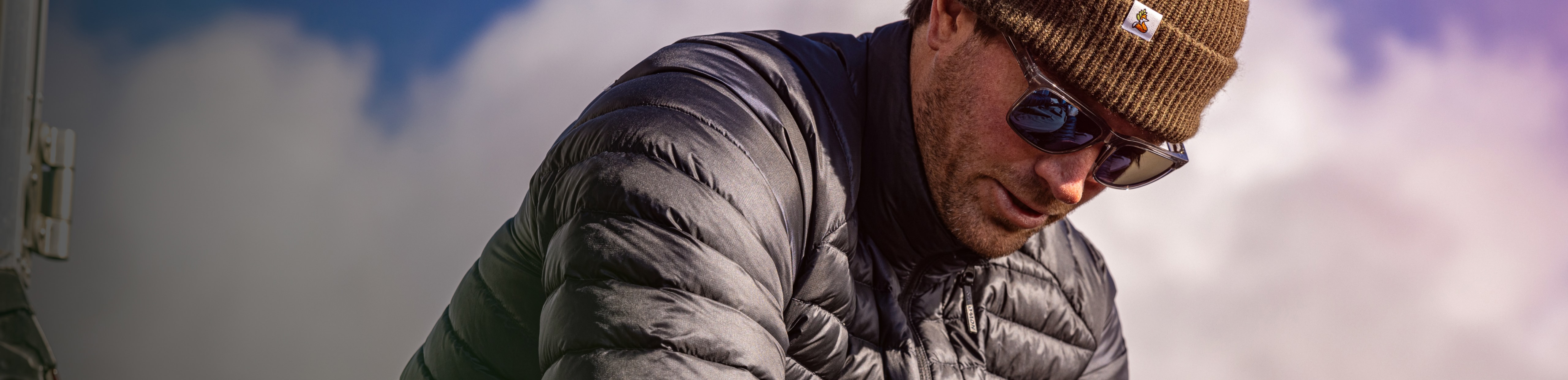 Man wearing beanie and Barton sunglasses
