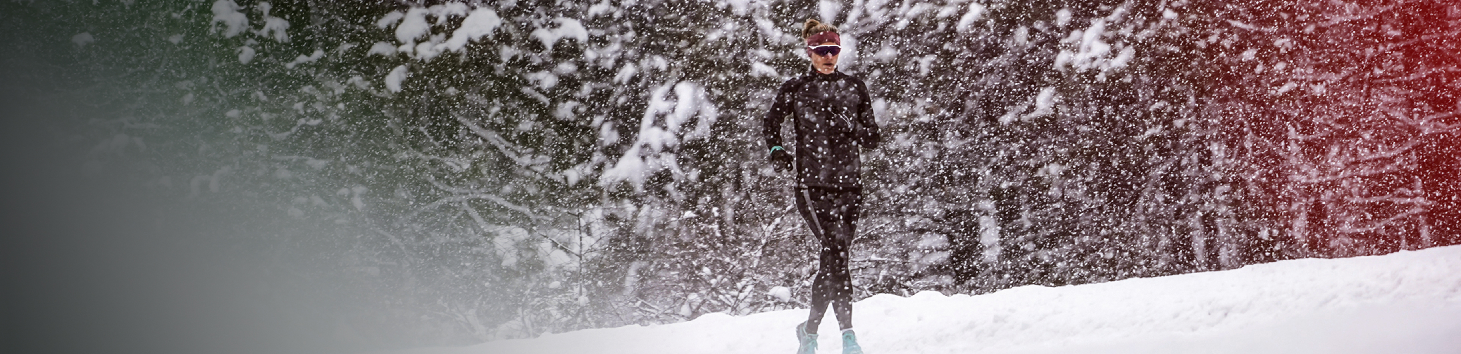 Man running in snowy forest