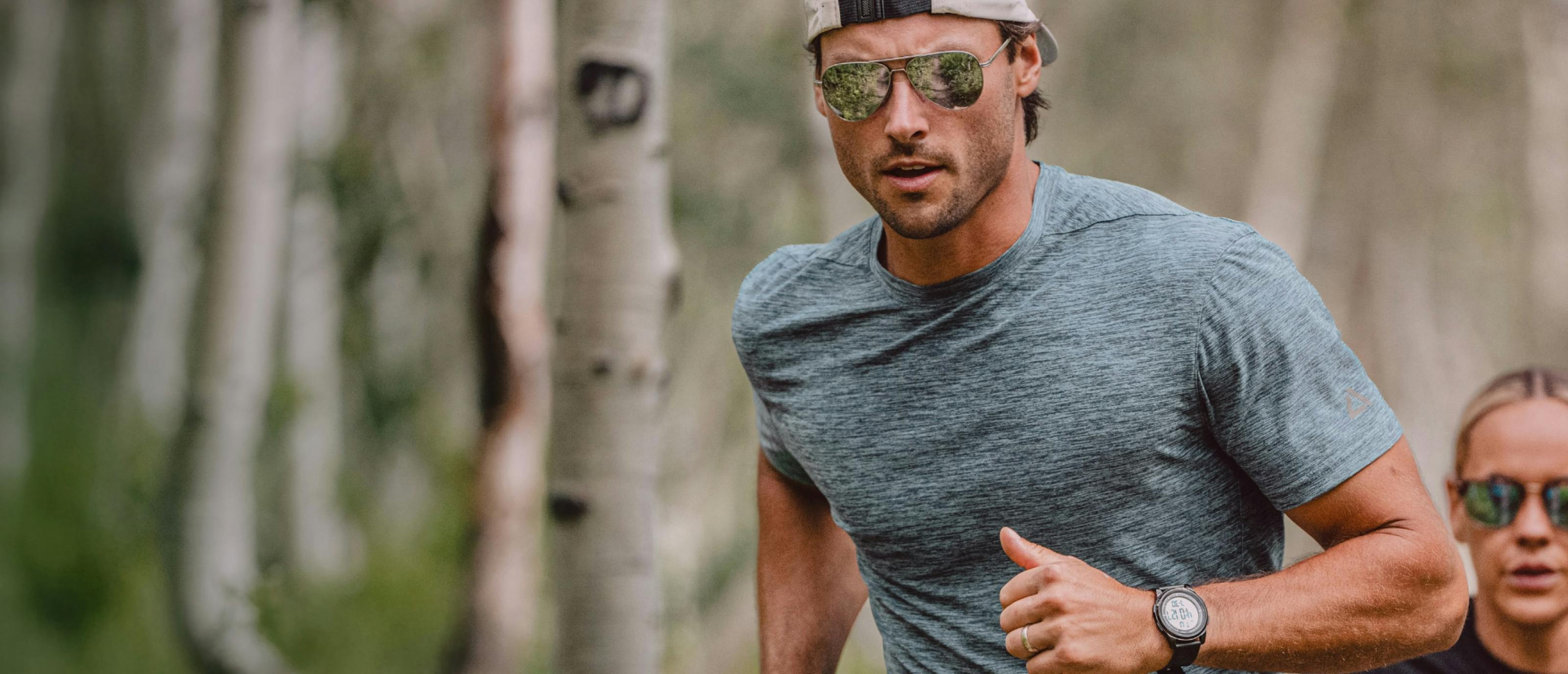 Man and woman running in woods