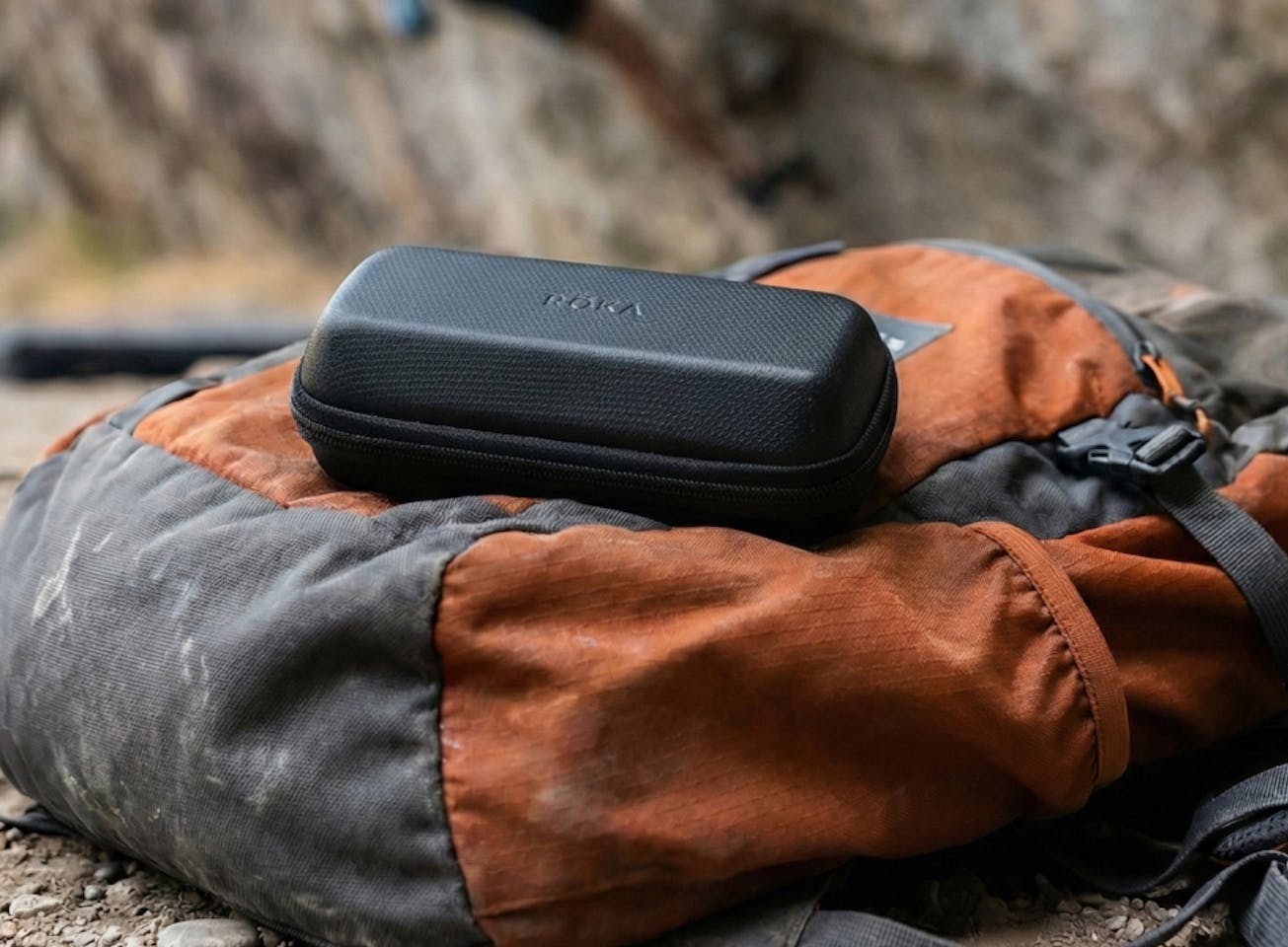 Travel case on top of backpack