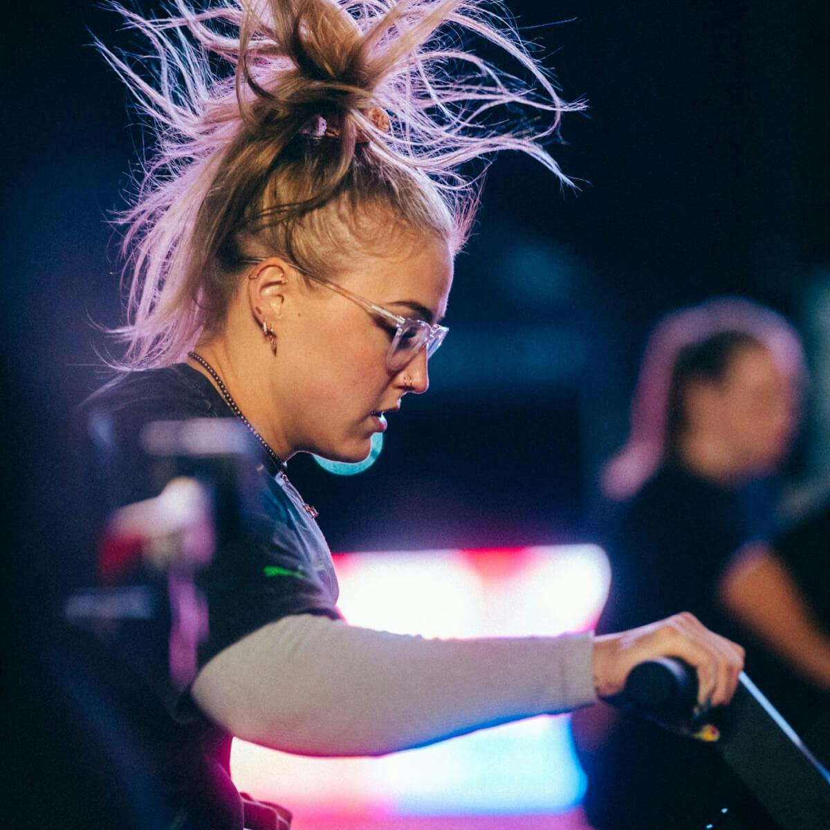 Woman wearing eyeglasses working out. 
