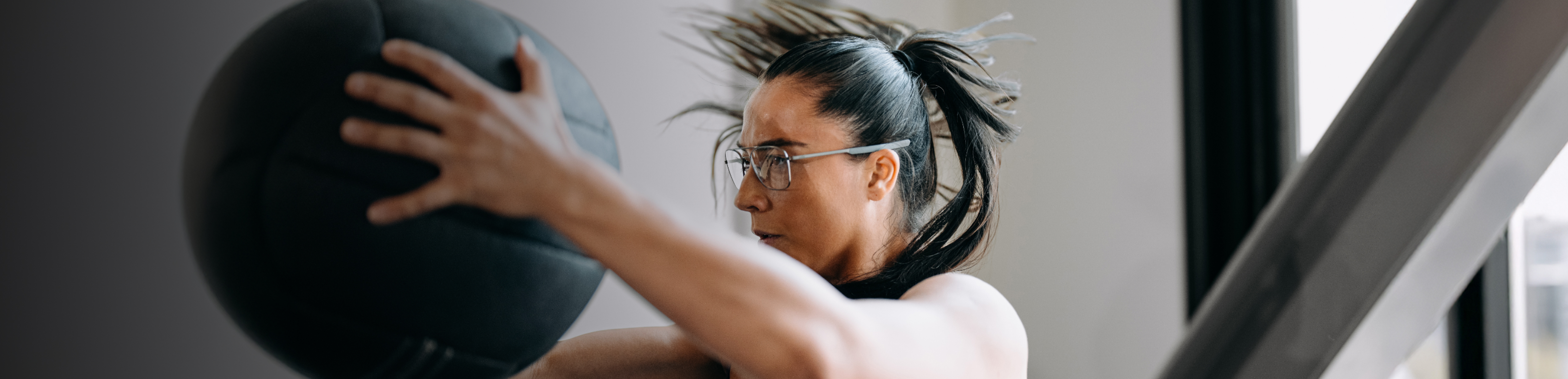 Woman working out with medicine ball