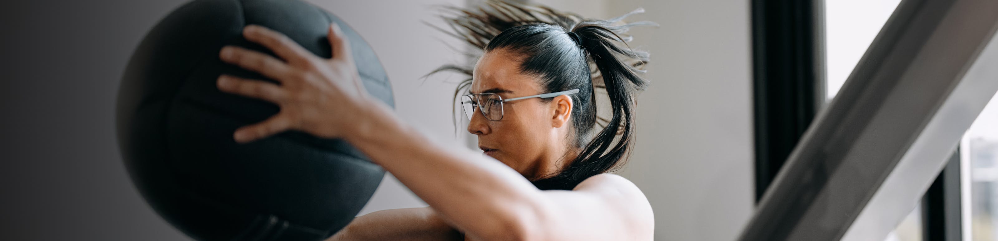 Woman working out with medicine ball