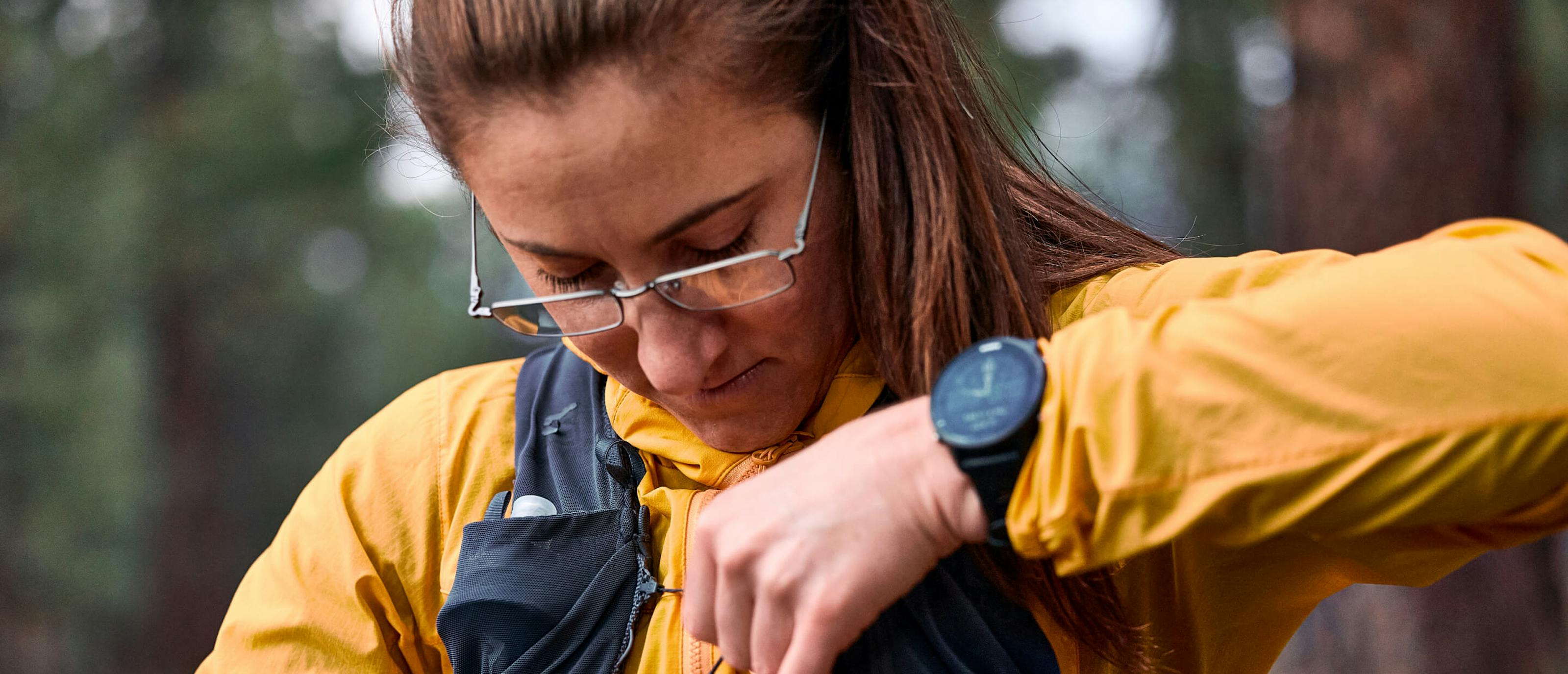 Woman wearing Ion glasses and orange jacket