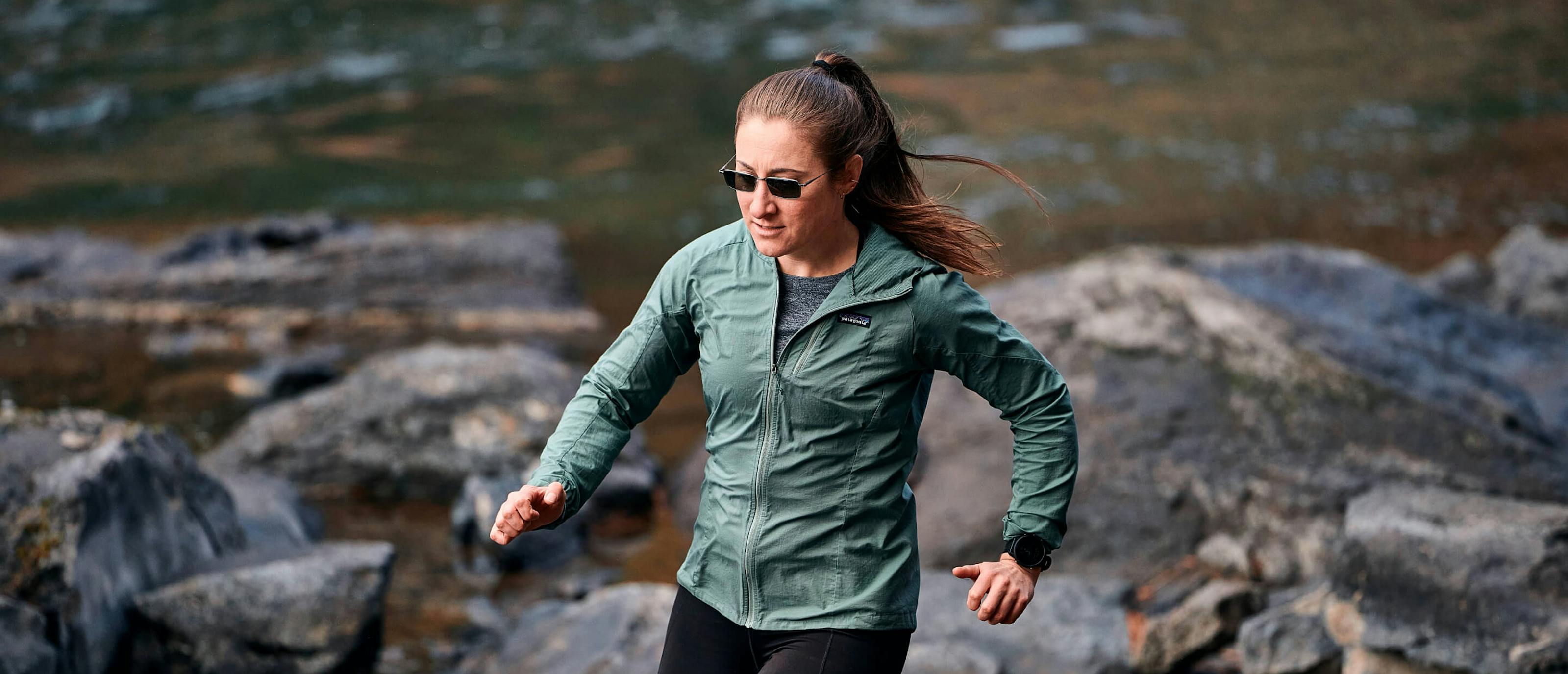Woman running near creek