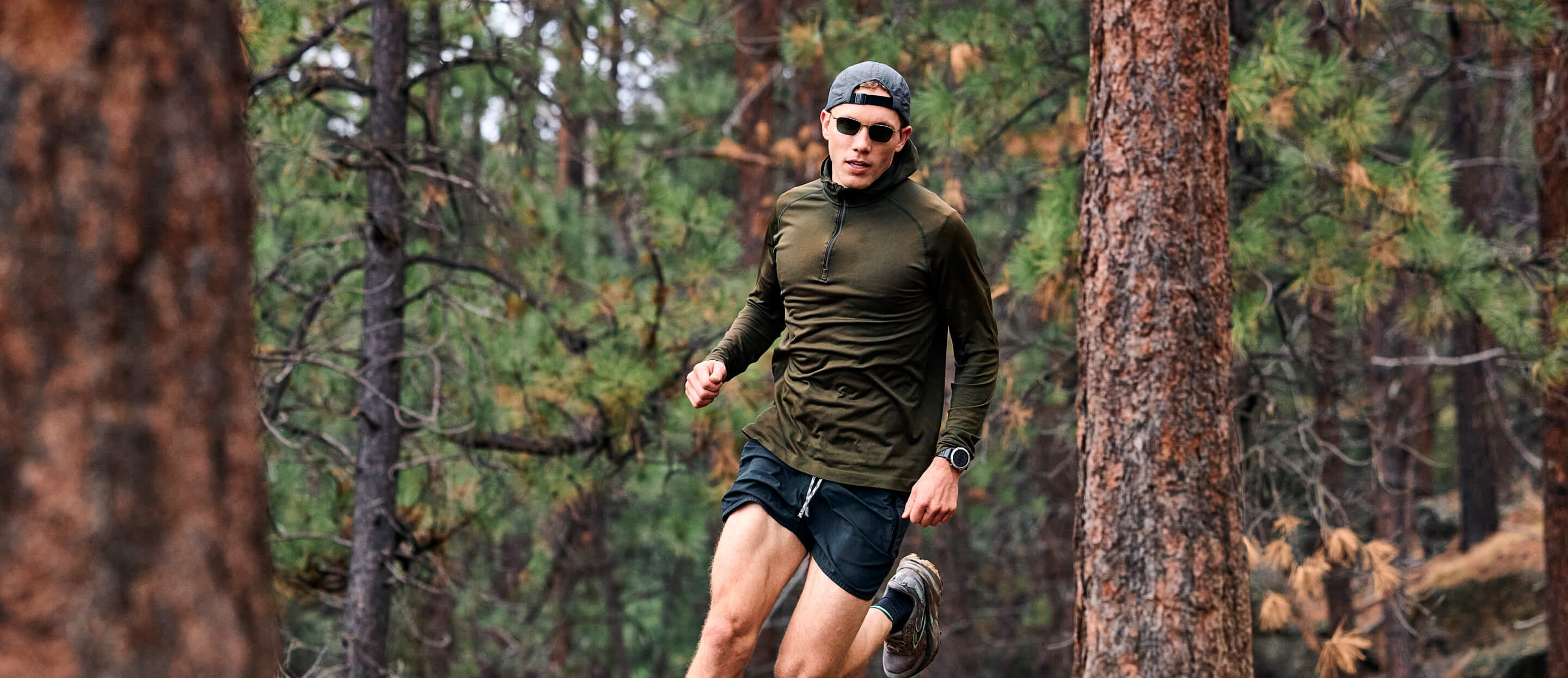 Man running in woods wearing Vapor Nano sunglasses