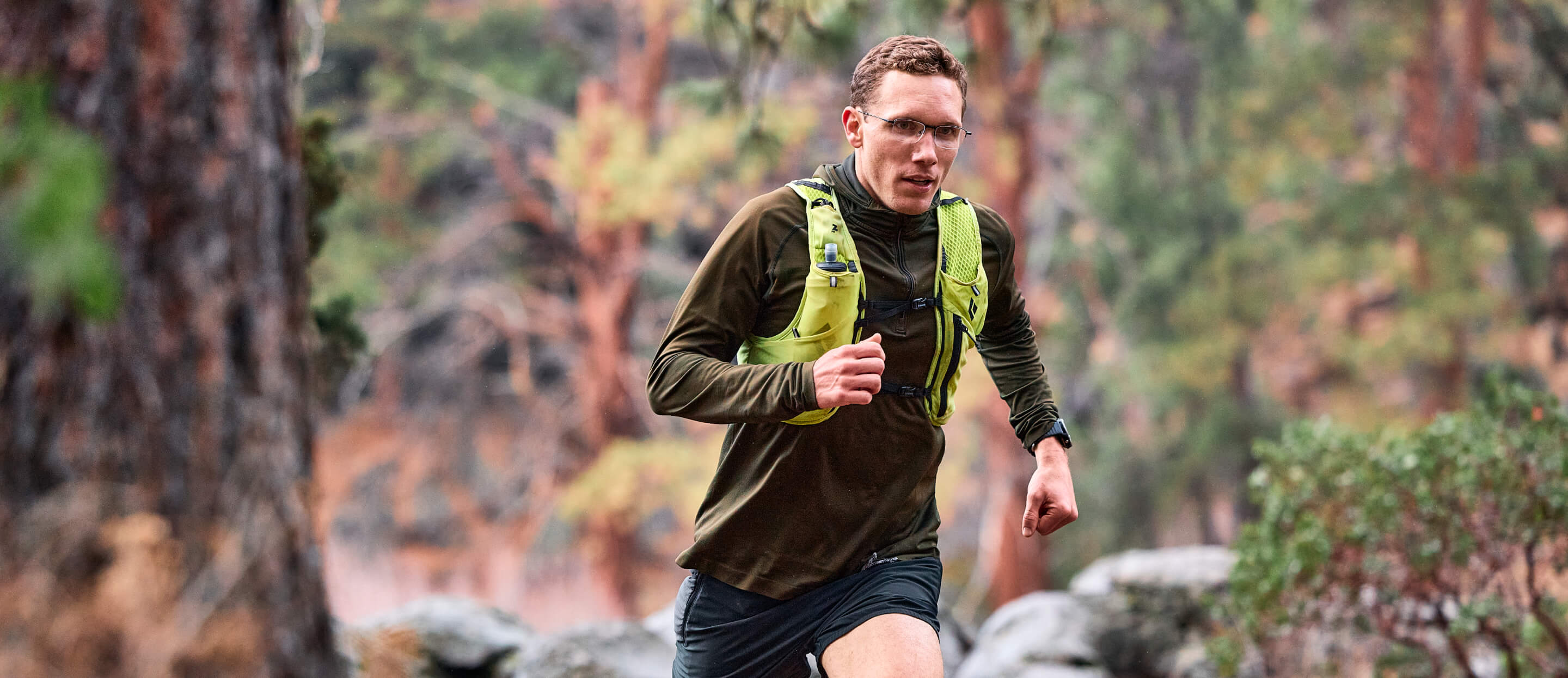 Man running in woods wearing Vapor Nano glasses