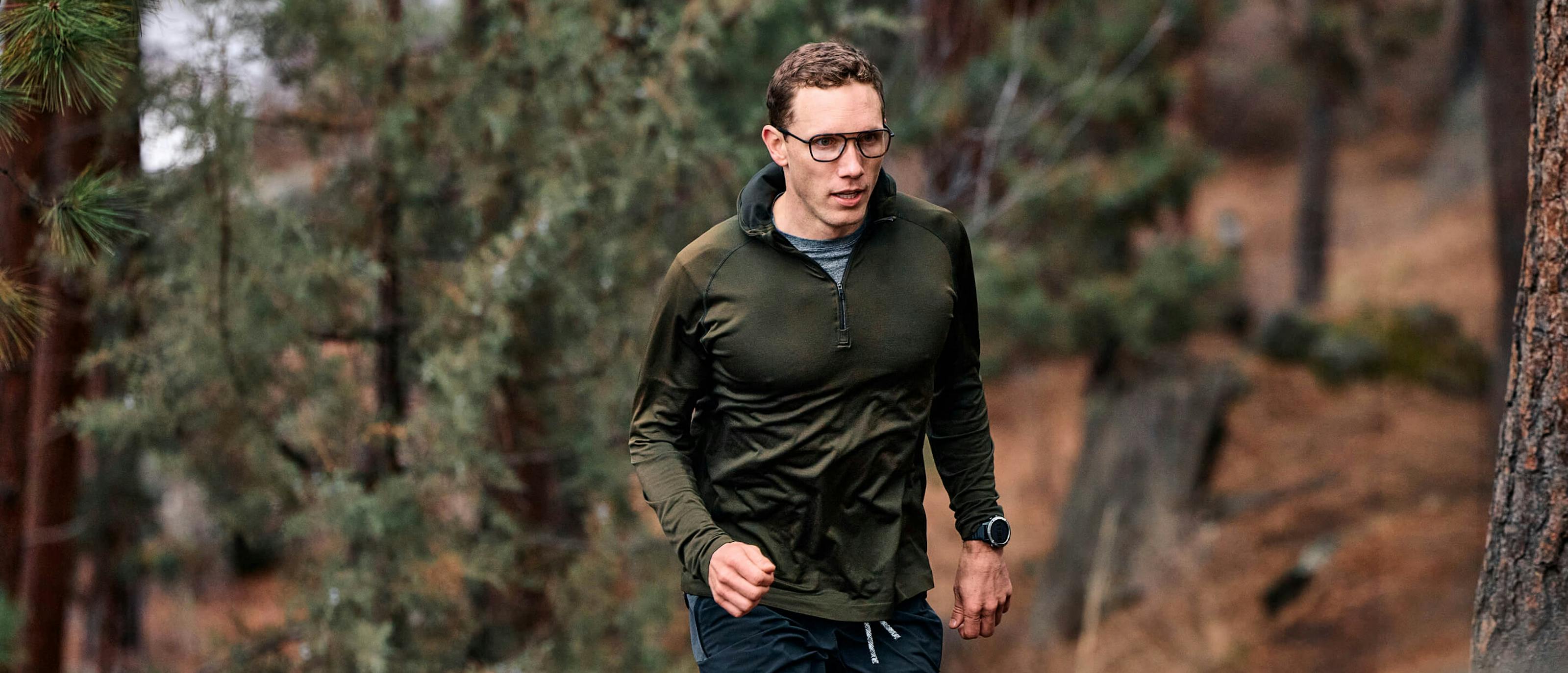 Man running in woods wearing Falcon Fusion eyeglasses