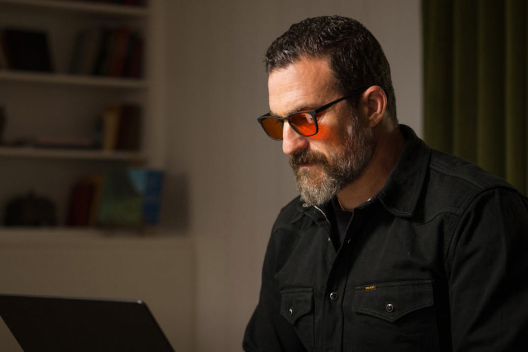 Dr. Huberman looking at his laptop