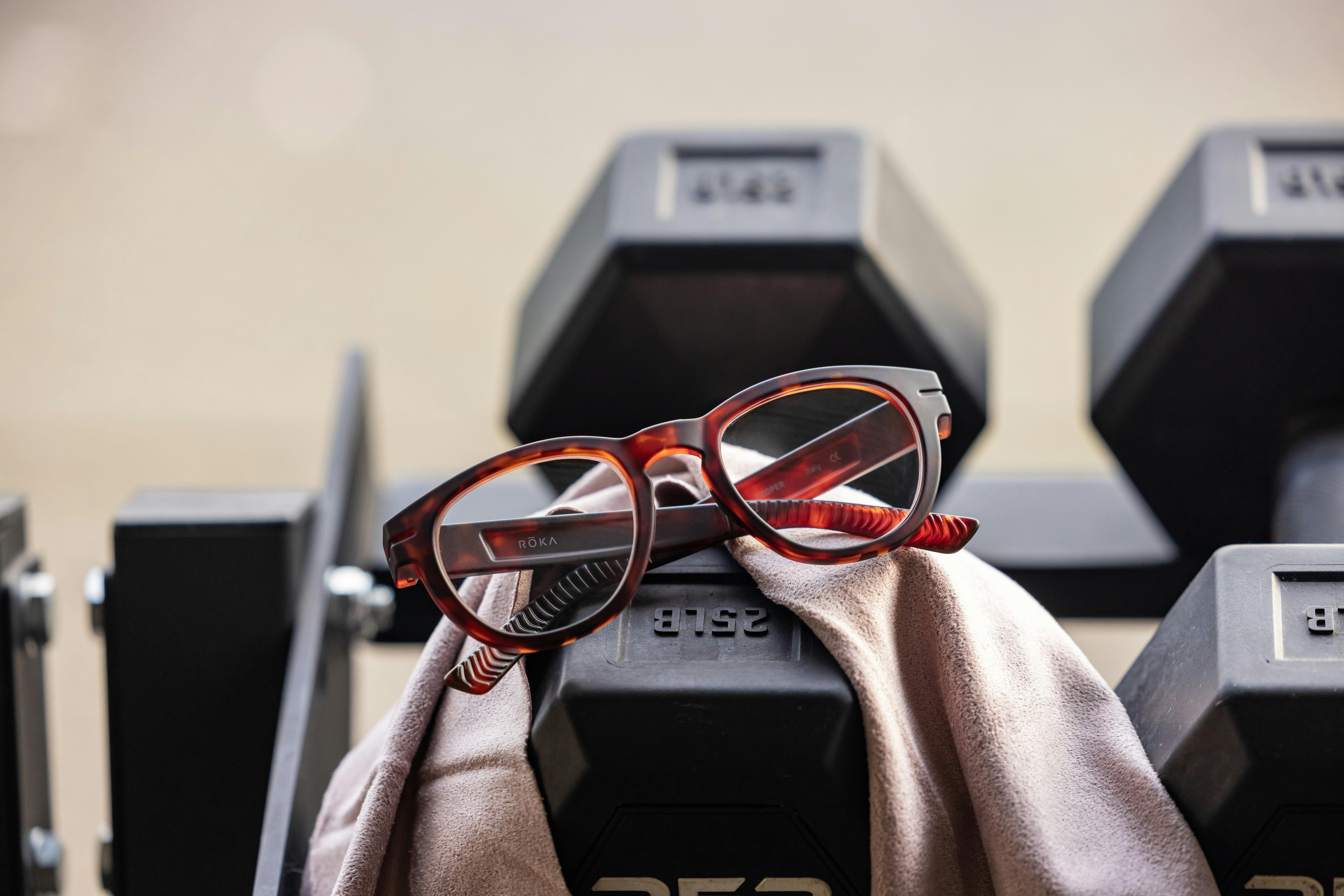 Eyeglasses resting on weights