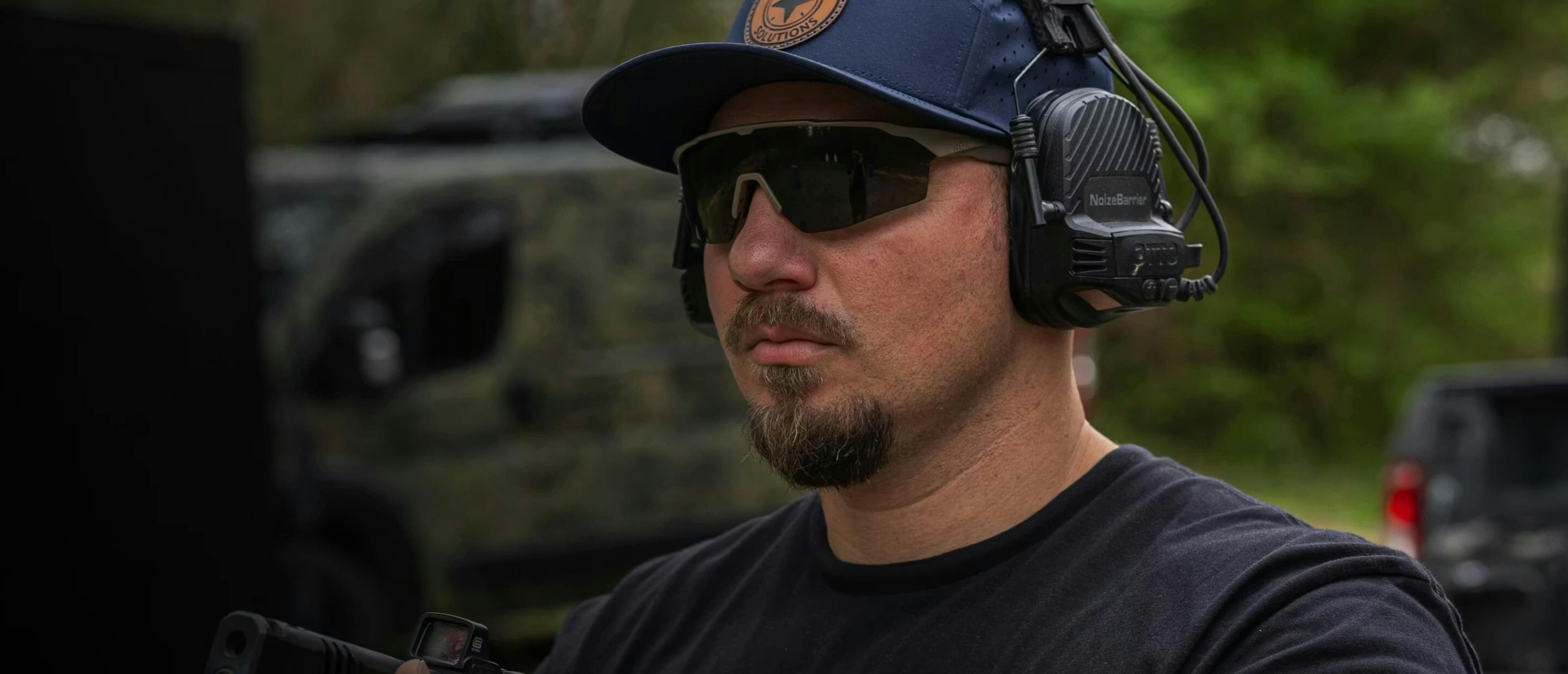 Man wearing protective glasses and ear protection