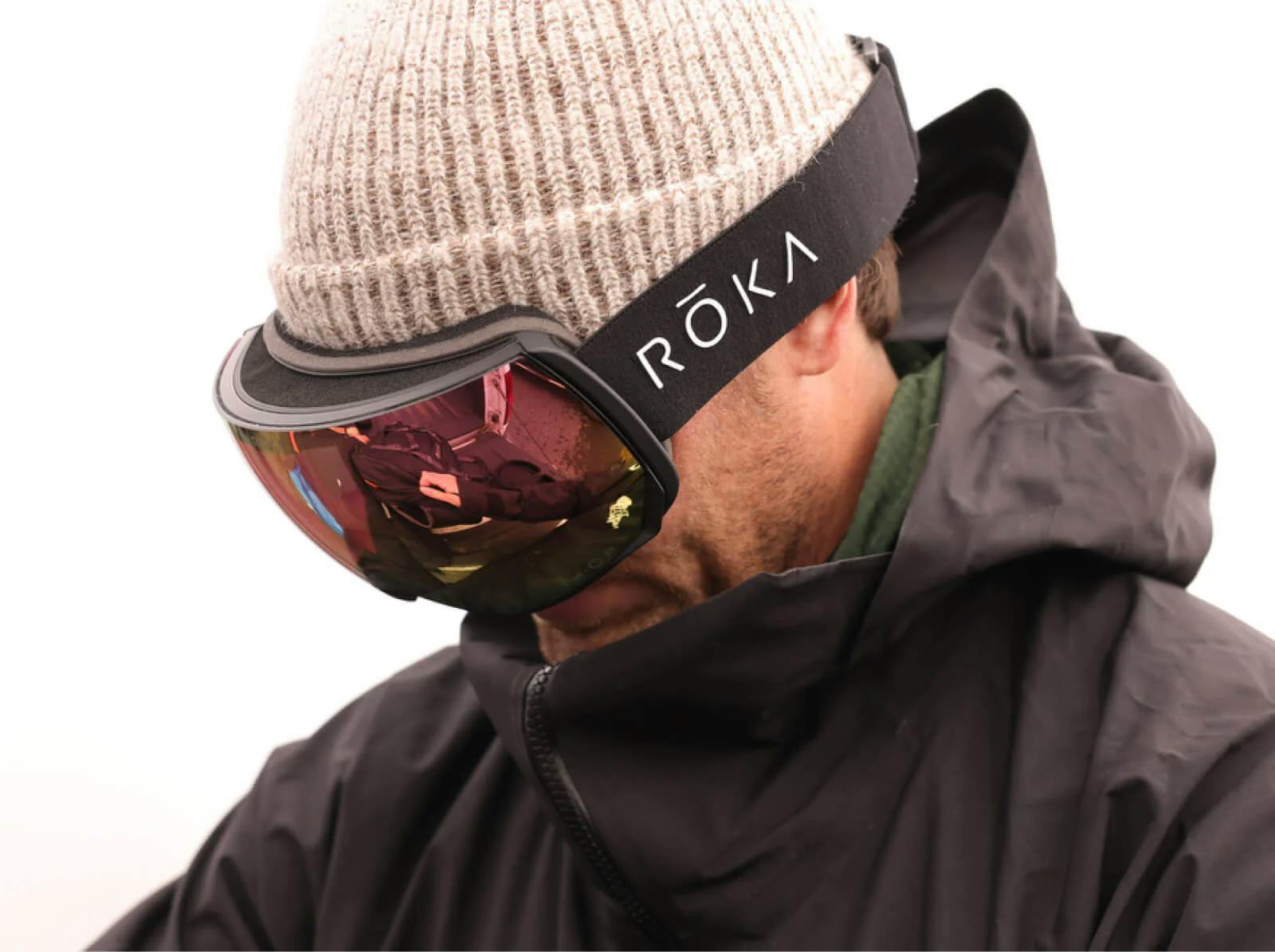 Man looking down while wearing Bridger goggles