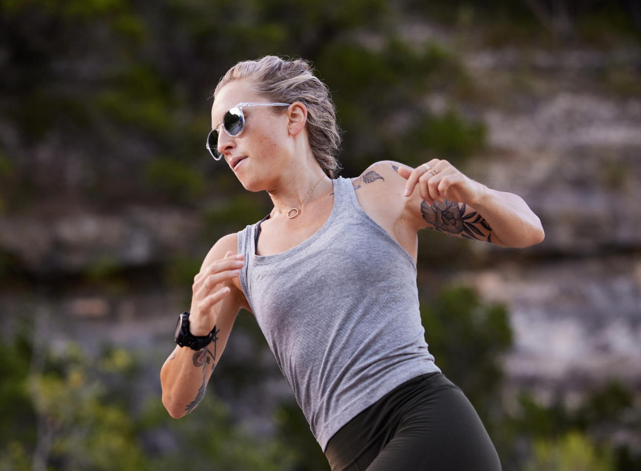 Women running wearing grey tank top and Hunter Sunglasses