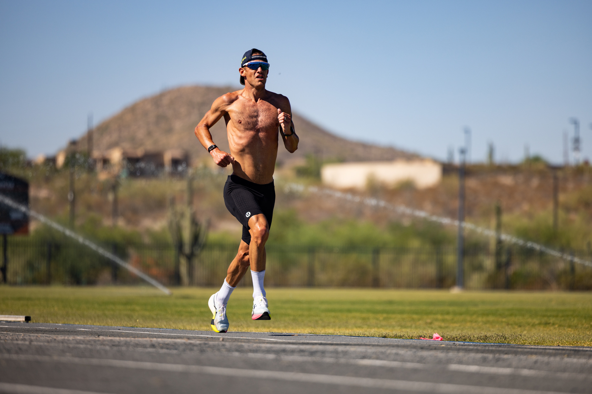 man training on a track outdoors