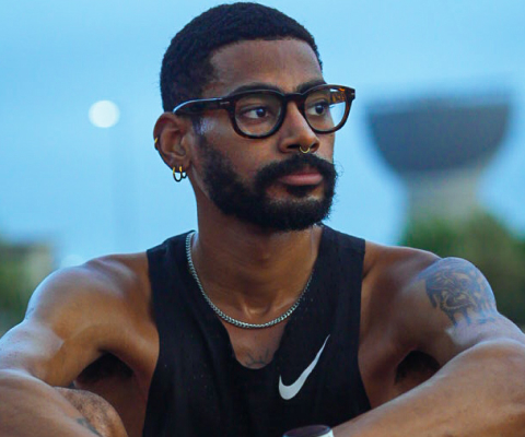 Man wearing black tank top and Hamilton eyeglasses