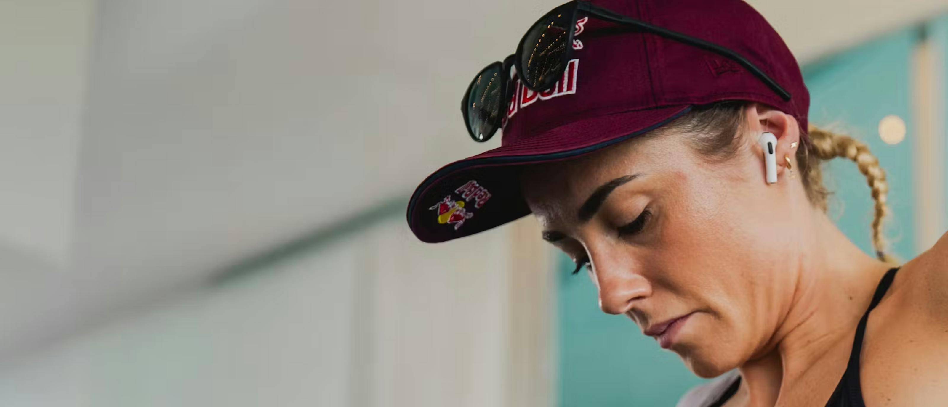 Woman in maroon hat and Lola sunglasses