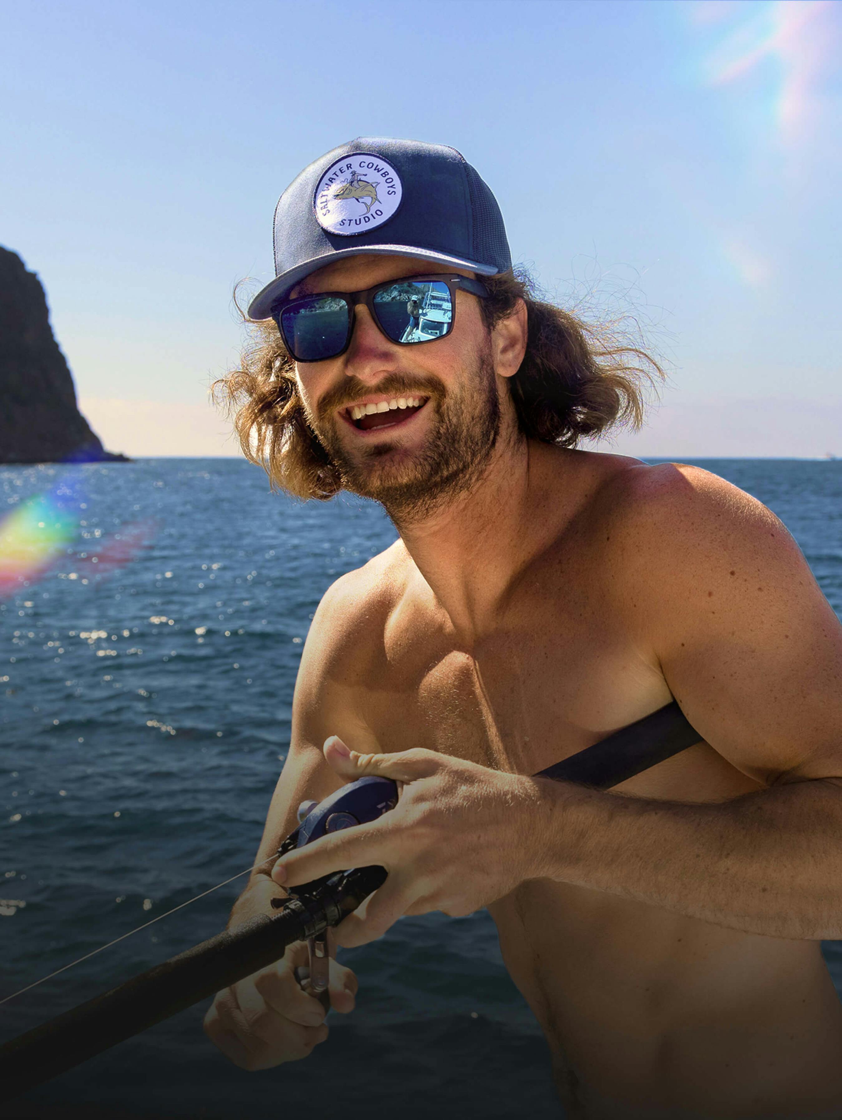 Man on ocean wearing Barton sunglasses