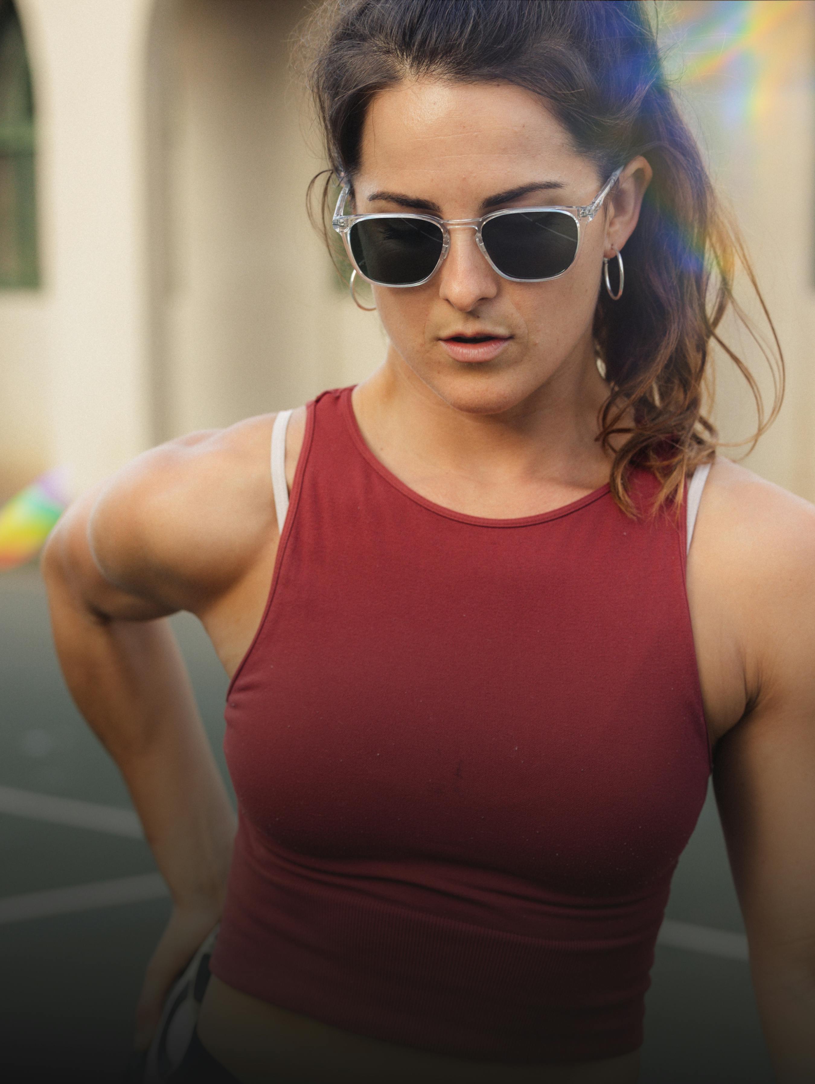 Woman wearing red tank top and ROKA sunglasses