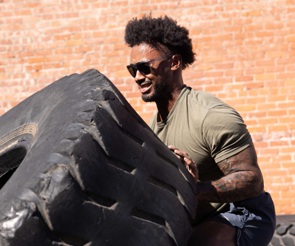 Man flipping tire