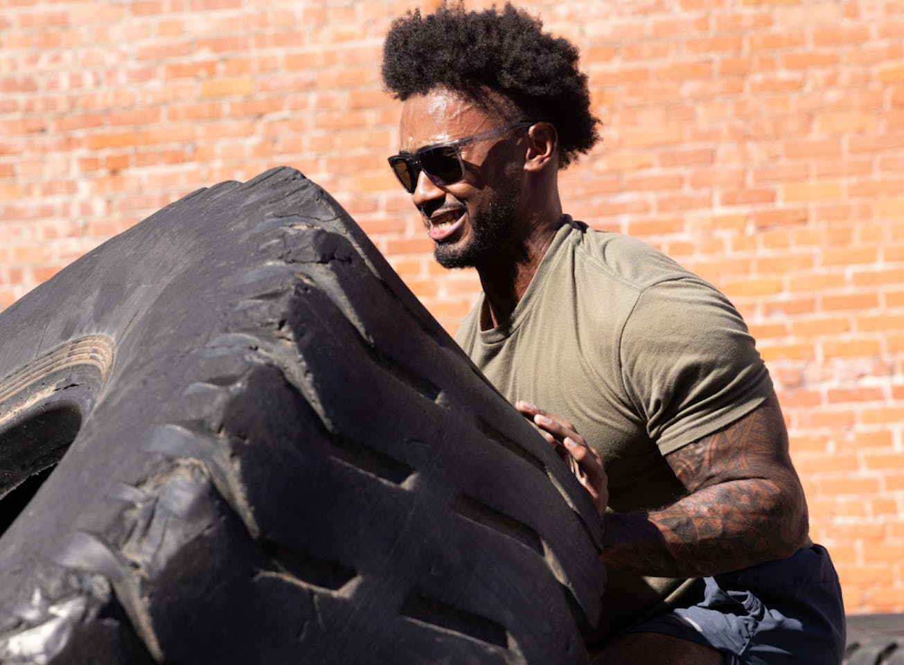 Man flipping tire