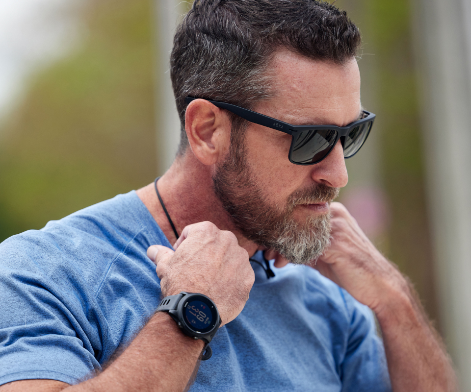Man in blue shirt and Braker sunglasses