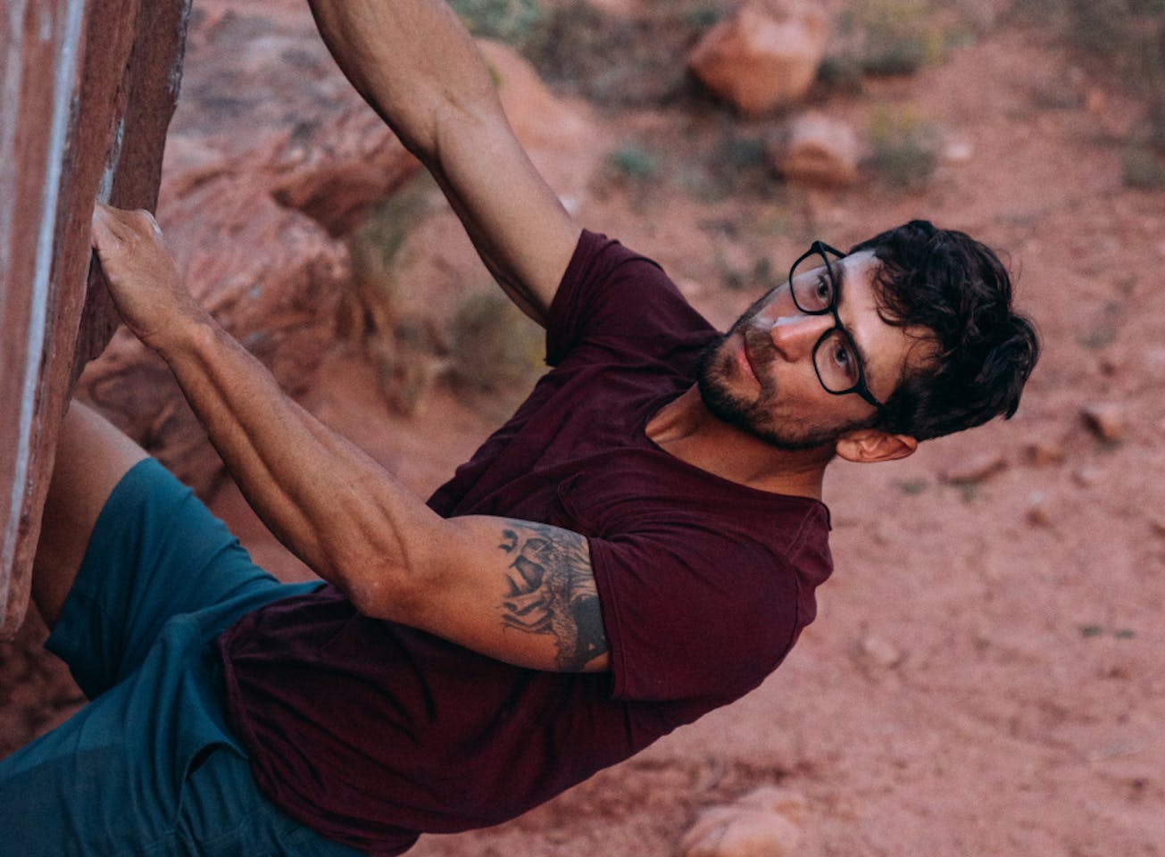 Man rock climbing in Cade eyeglasses