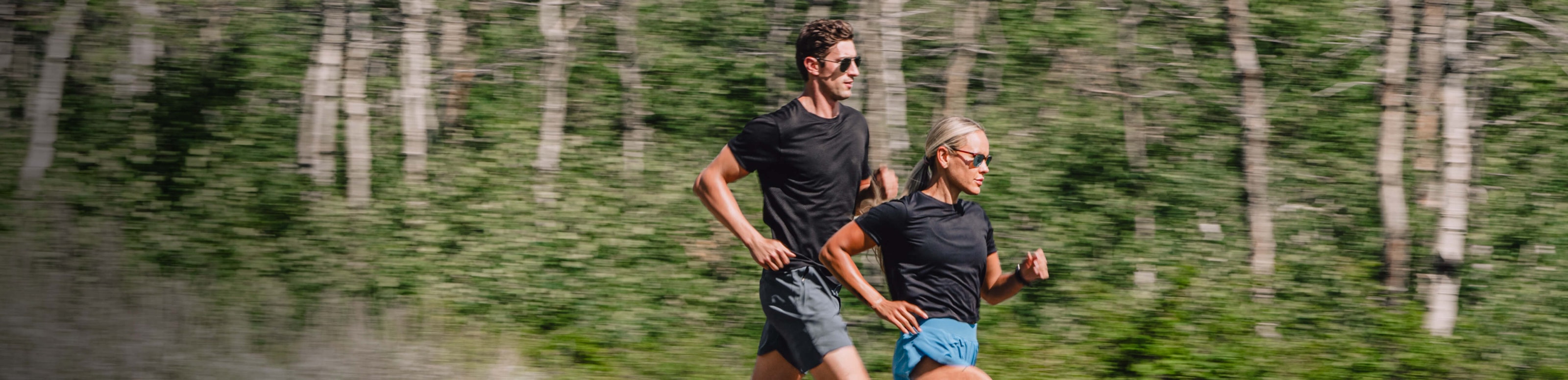Man and woman running in the woods