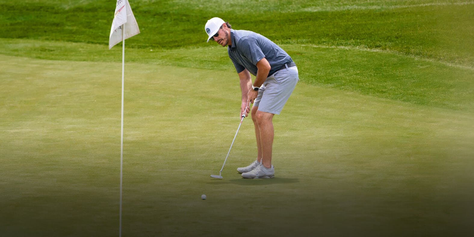 Man on putting green