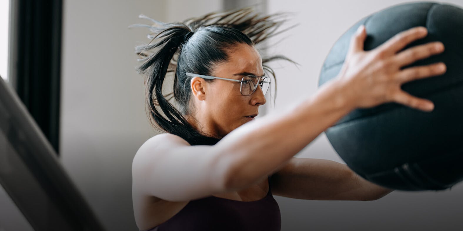Woman working out with medicine ball