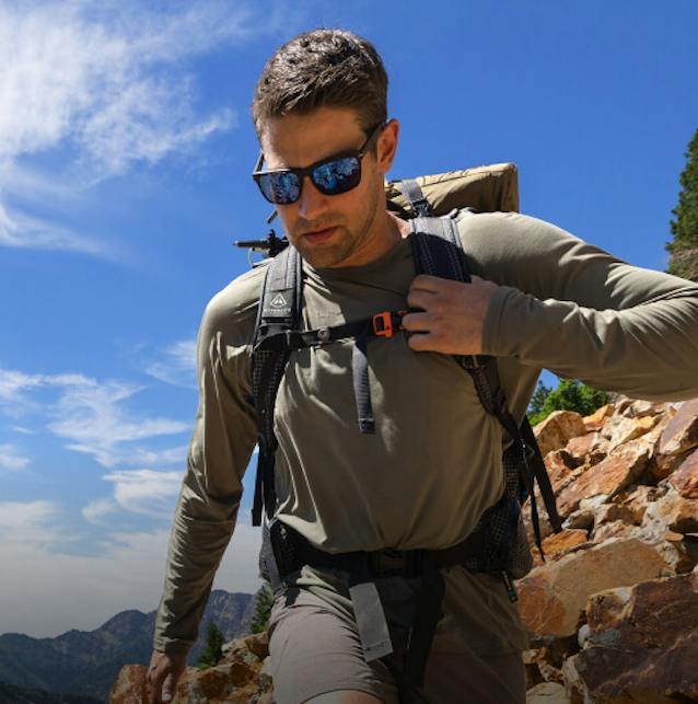 Man backpacking wearing ROKA sunglasses